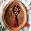 Meditační mala - Rodonit a Rudraksha RED se stříbrným logem (Ag 925/1000)